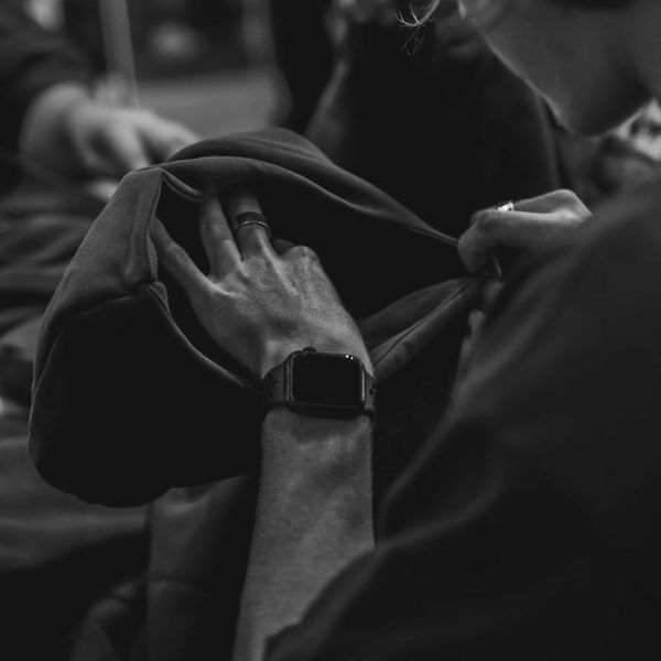 Hands folded in a gesture of calm and focus.